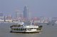 China: Cruise boat on a misty Huangpu River, Shanghai (c. 2000 CE)
